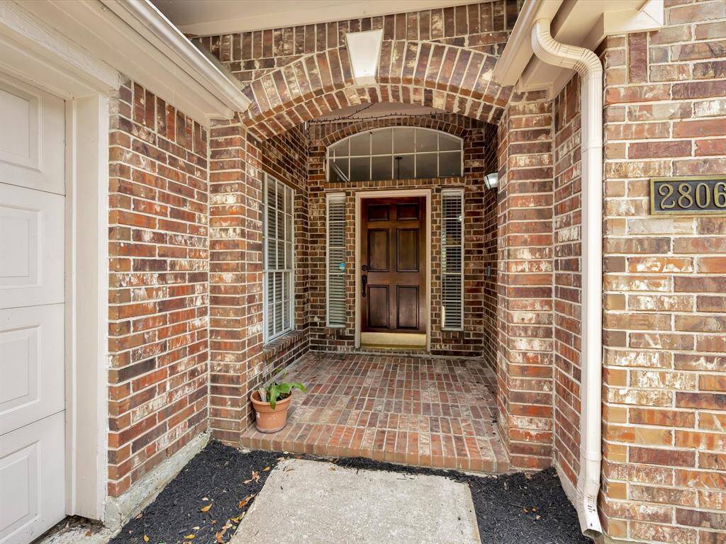 Covered front entry offers security and helps guard against the weather