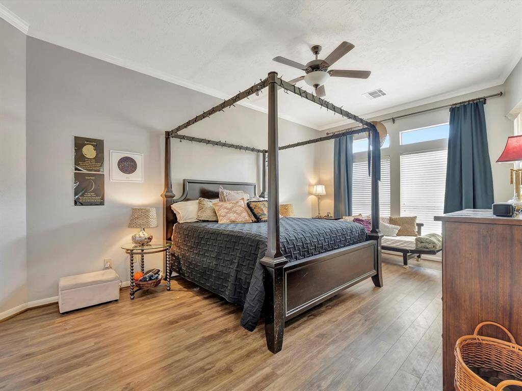 Primary bedroom with high ceilings, room for a cozy reading nook