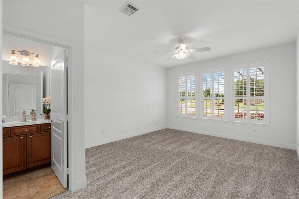 The guest bedroom features brand new plush carpeting and a private en-suite, creating a cozy and welcoming retreat for visitors.