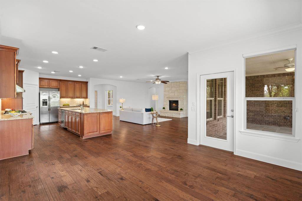 A seamless view from the dining room flows into the kitchen and gathering space, creating an open, interconnected area perfect for both everyday living and entertaining.