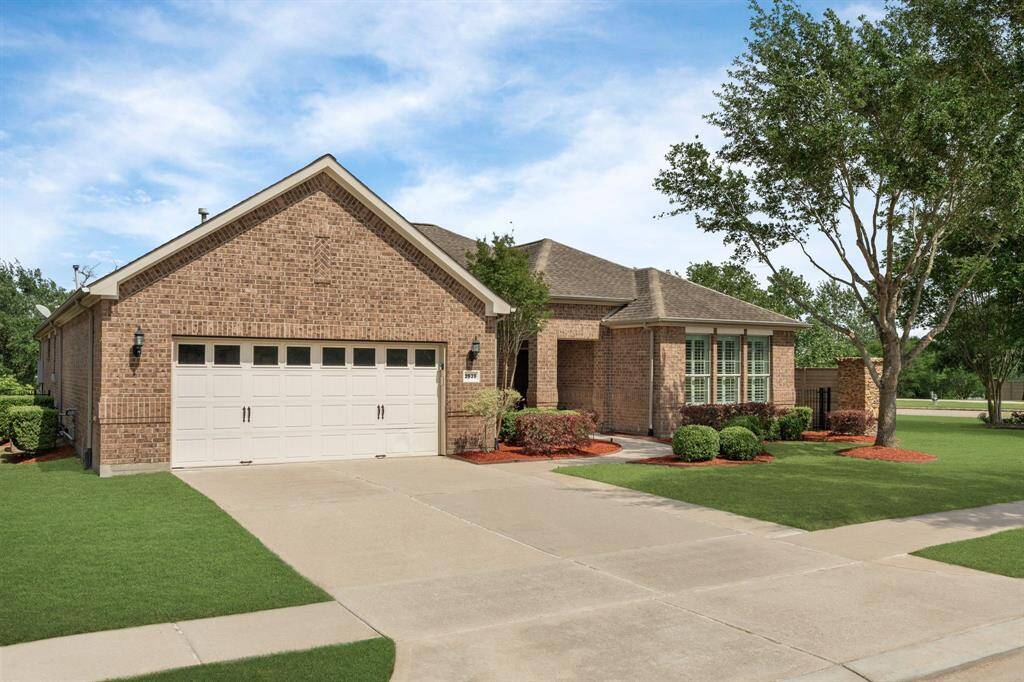 The windows on the garage door bring in natural light, creating a brighter, more inviting space as you enter the garage.
