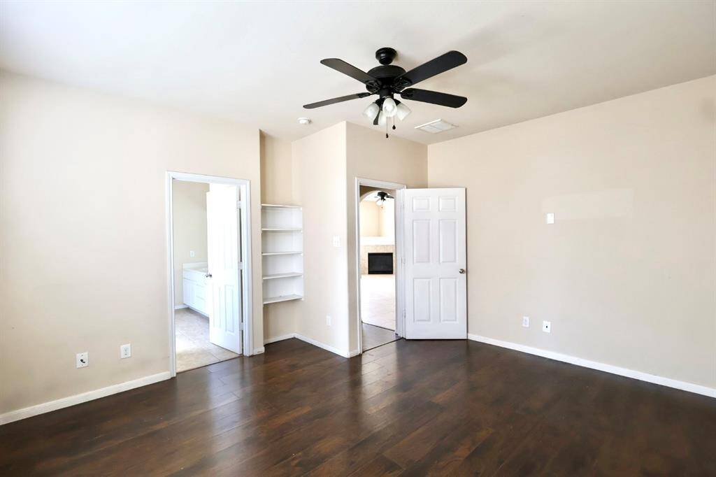 View of the primary bedroom just off the living room