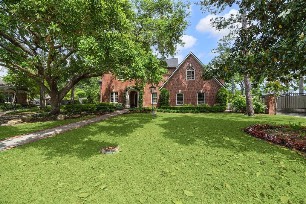 Classic elegance with manicured grounds, towering trees, and timeless curb appeal all come together in this small cul-de-sac