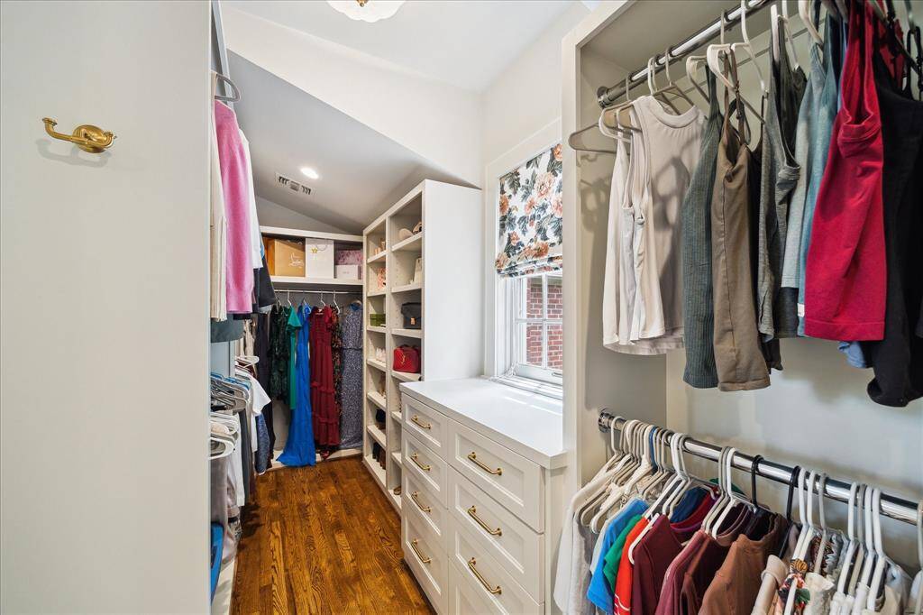 Boutique-style dual closets with custom cabinetry, built-ins, and thoughtful storage solutions.