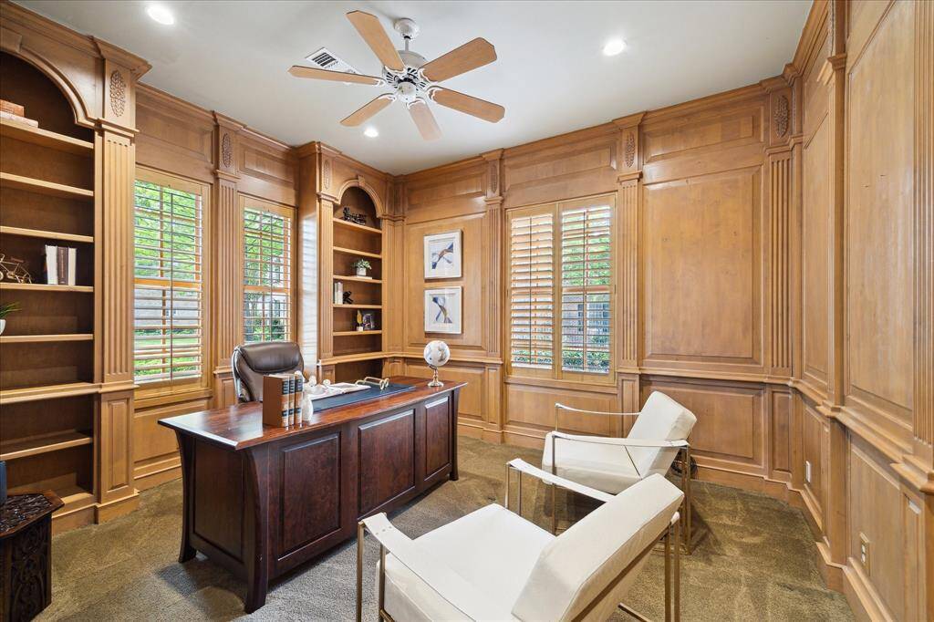 One of two home offices — custom built-ins, natural light, and space to focus or relax.