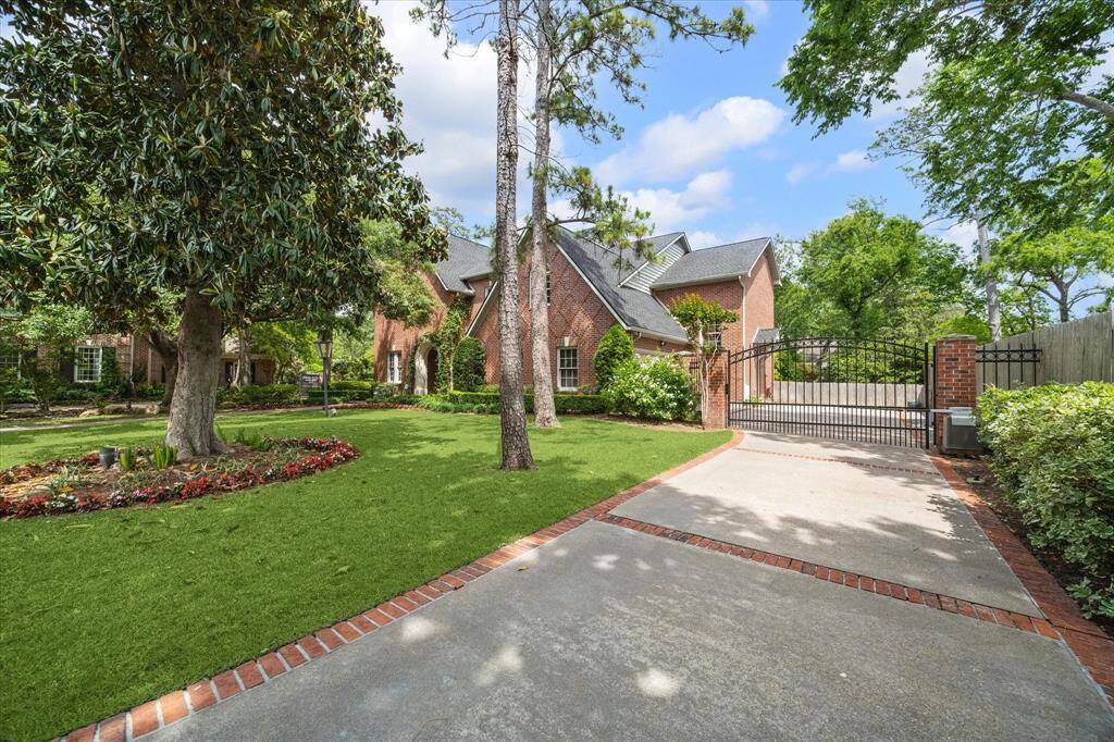 A gated motor court adds privacy and security, with ample space for guests and seamless access to the garage wing. 4 car parking is featured behind the gate