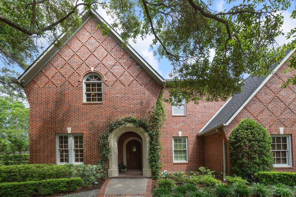 Stately brick architecture, soaring trees, and manicured gardens create a striking approach worthy of this Memorial showplace.