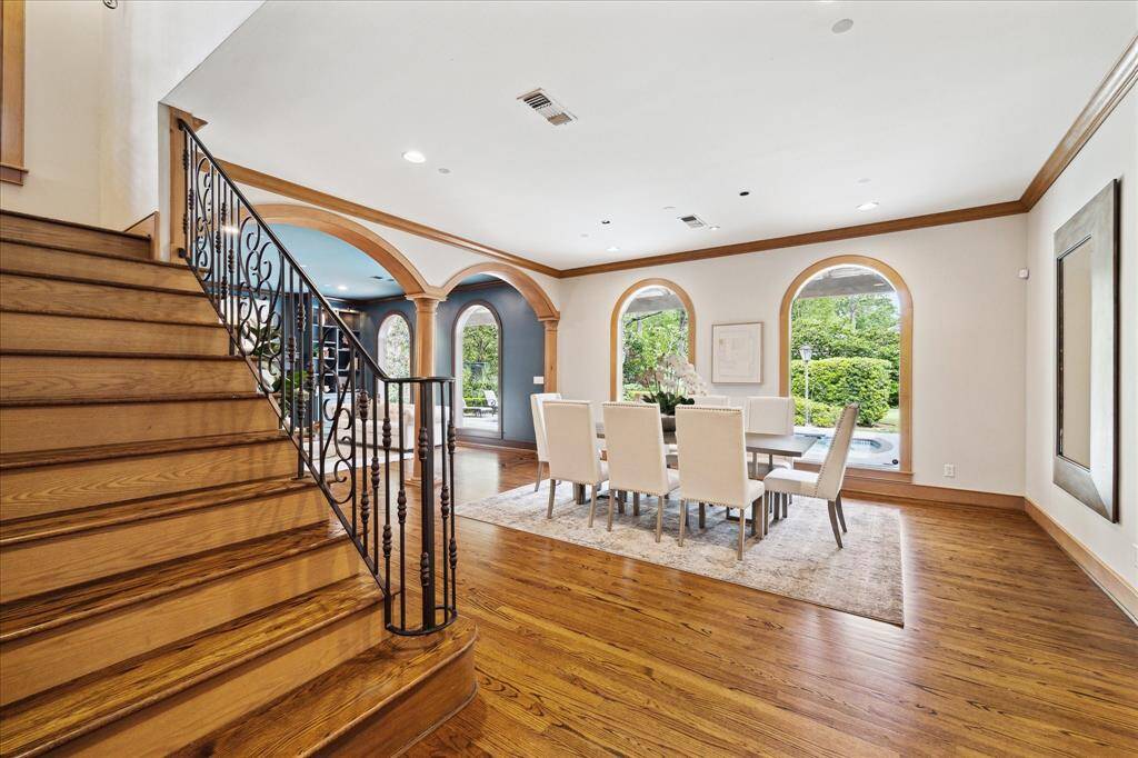 Warm oak floors and rich millwork set the tone in this welcoming, light-filled entry.