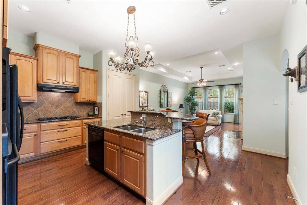 The kitchen island provides additional seating and storage space.