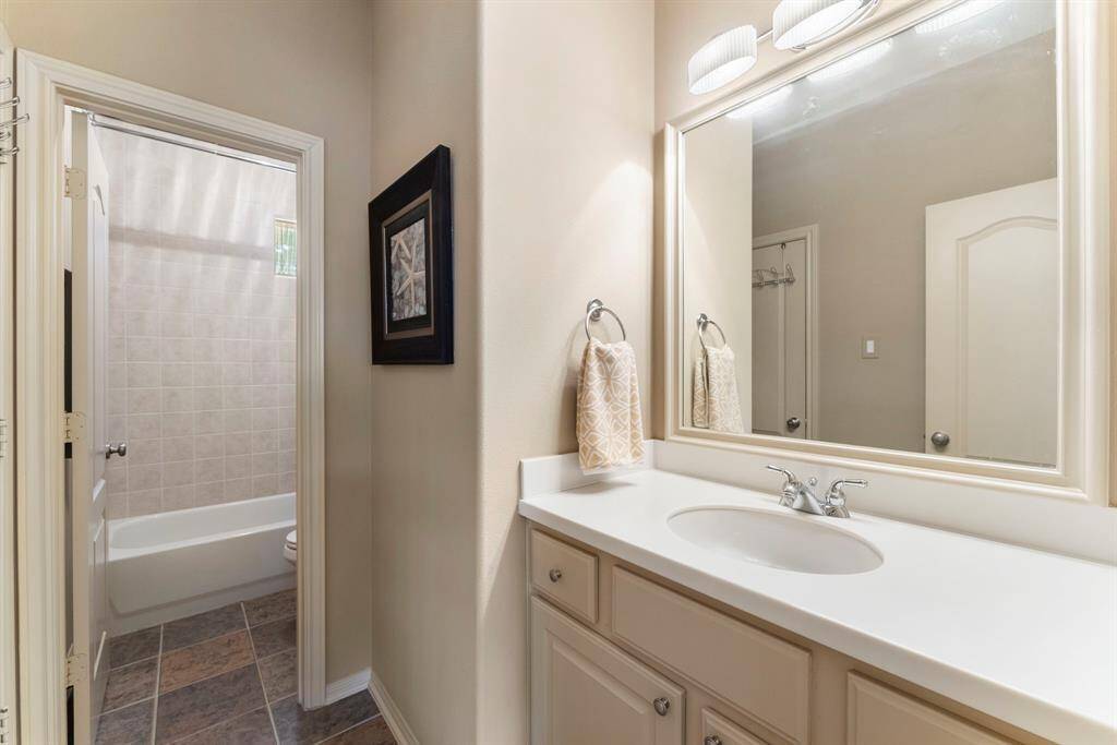 Secondary bathroom on the second floor. Accessible through the secondary bedroom as well as from the den.