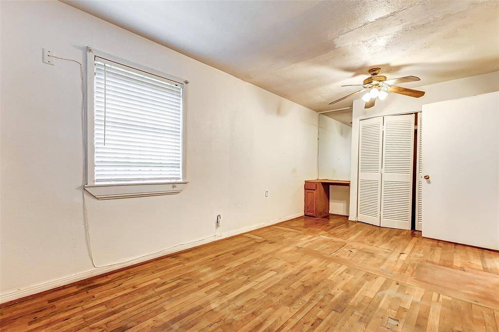 One of the three bedrooms with built in vanity and mirror.  Also good closet space