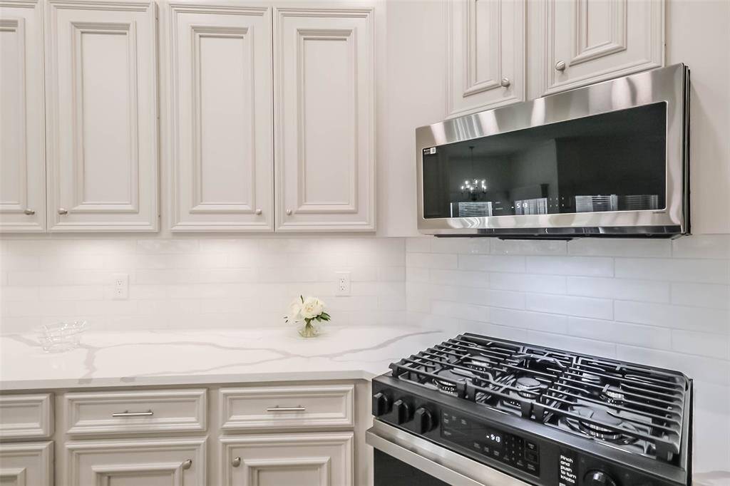 Tons of storage and prep space in this kitchen. Extra-long serving/breakfast bar.