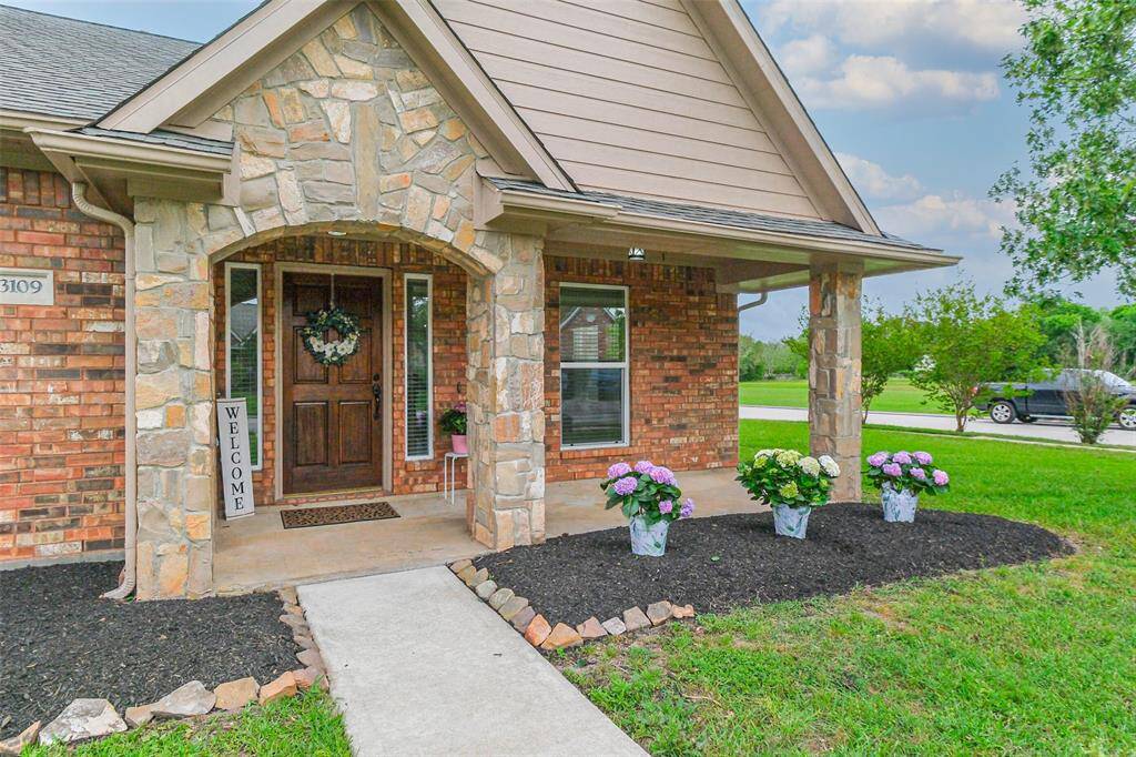 Lovely brick & stone one-story home with brand new 30 yr roof and all new double paned windows.