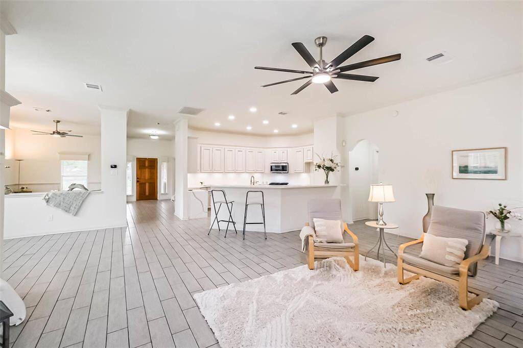 Another view of the family room. At far left is the hallway leading to the laundry room and the primary suite.