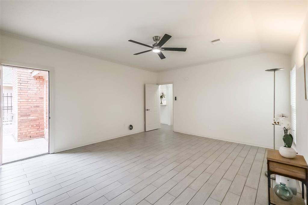 A short hall from the family room takes you to the primary suite with new LED remote controlled, color changing light ceiling fan.