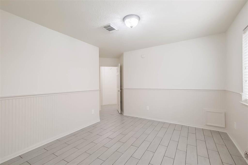 Full bath between both secondary bedrooms has quartz counters, undermount sink, temperature sensing stainless steel faucet with pullout. Private toilet and tub area has new toilet, new tile tub surround and stainless steel rainfall shower head with hand held spray wand.
