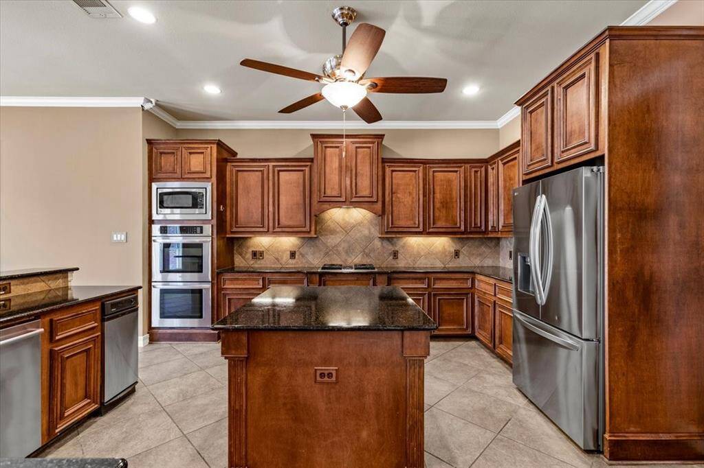 Incredible kitchen in this Perry home. Brand new top of the line stainless appliances and the fridge to stay!