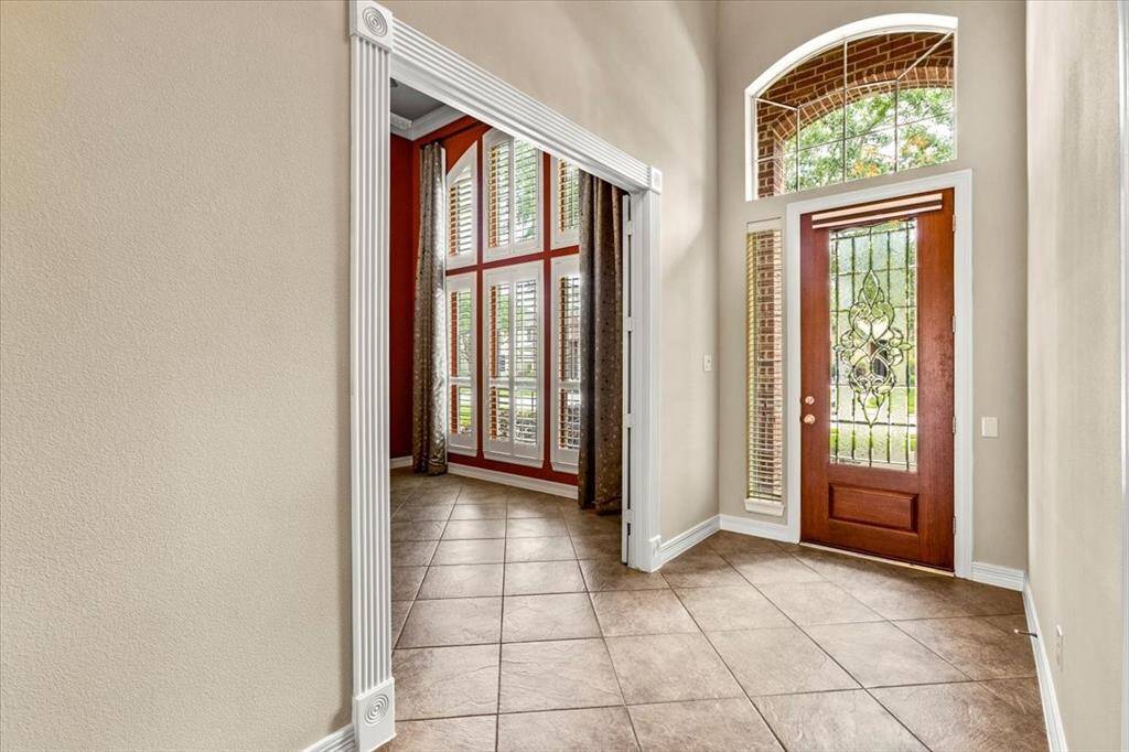 You'll be amazed the minute you open the front door of this beautiful home! The grand entrance, tall ceilings, and open space. Incredible!