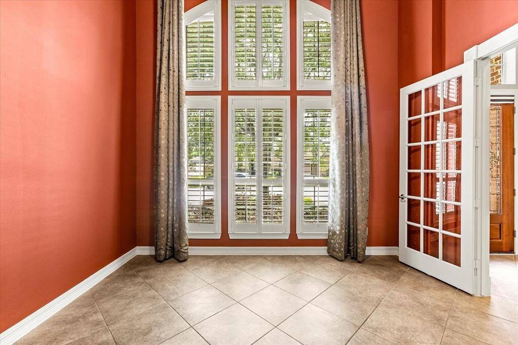 The gorgeous office with 10' ceilings and Plantation shutters is stunning!