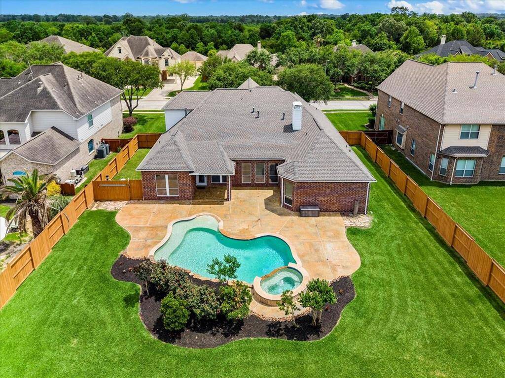 Amazing backyard and beautiful pool. The pool boasts an inground cleaning system so you will never have to vacuum or drag hoses around.