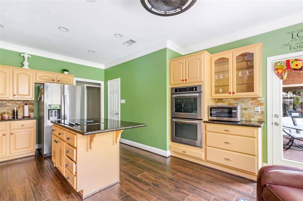 The kitchen has lots of cabinets and countertop space.
