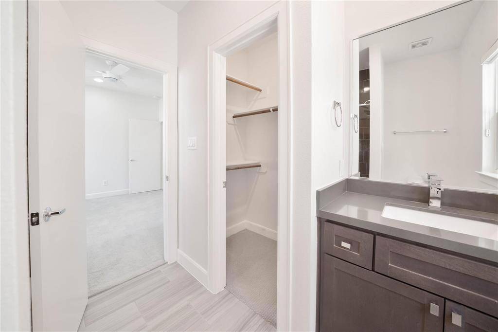 The full-entry closet in the en suite bathroom adds a touch of convenience, providing plenty of space for storage while keeping your essentials organized and easily accessible.