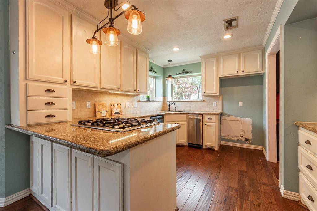 Granite countertops paired with custom kitchen cabinets