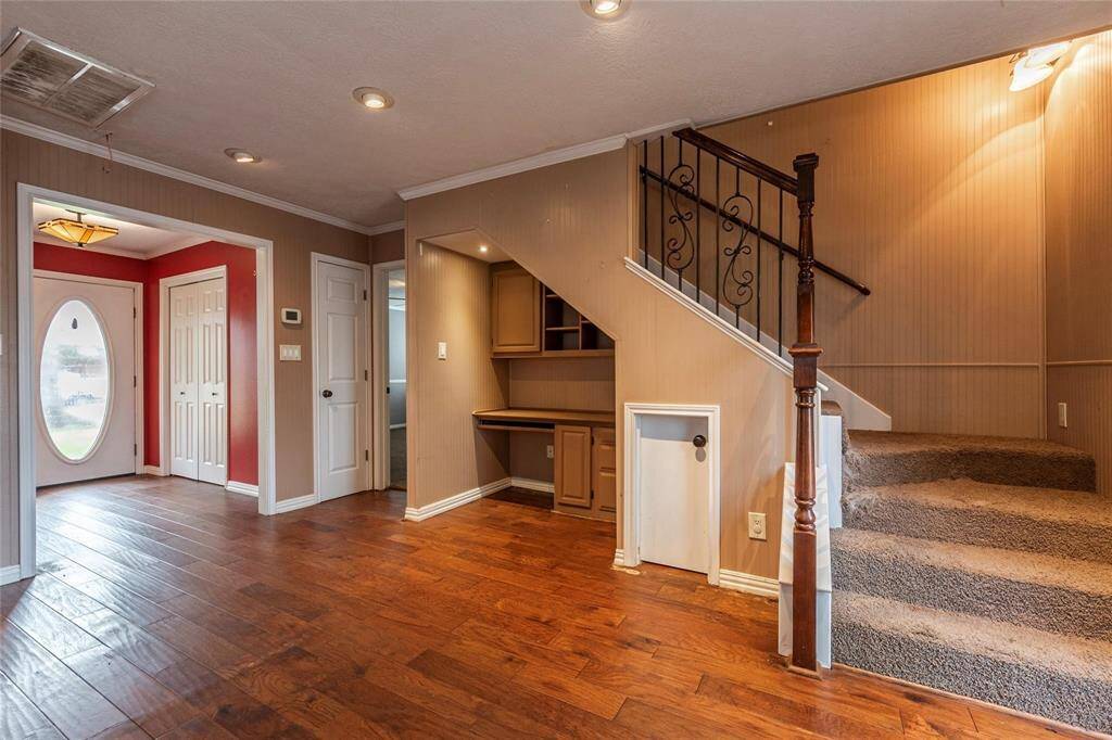 As you head up the stairs, you'll find additional bedrooms, a full bath and a flex space