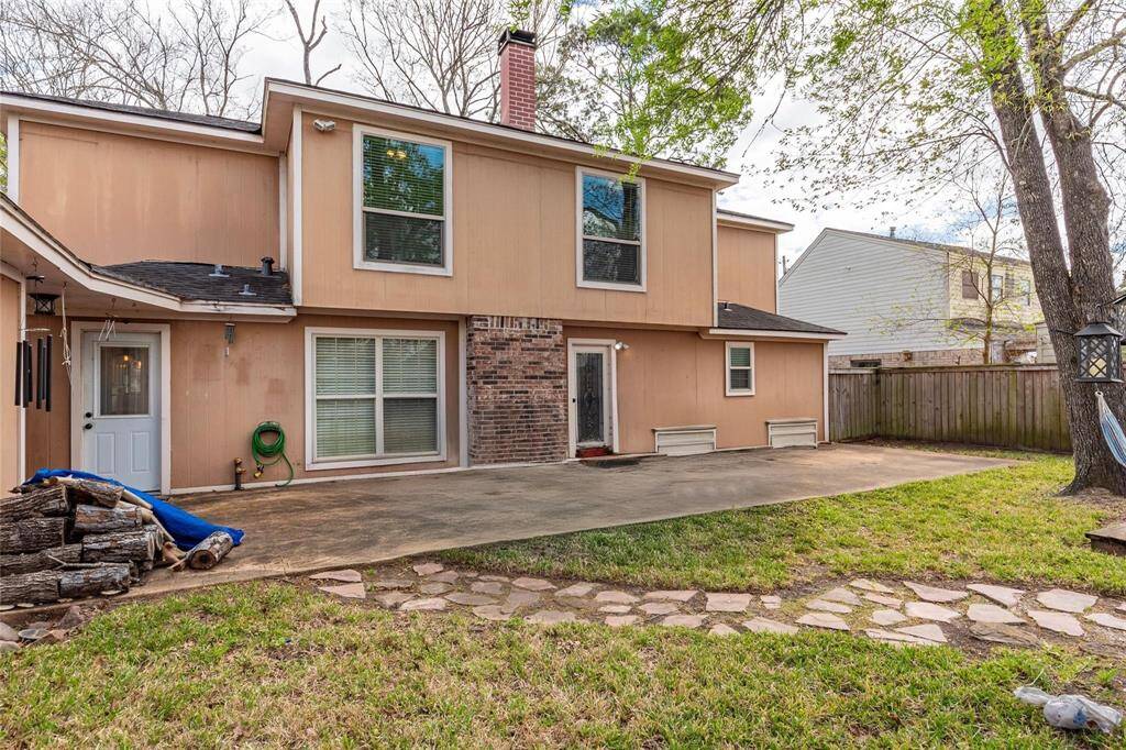 Back of home - currently has a trampoline on the patio - it will be removed prior to closing