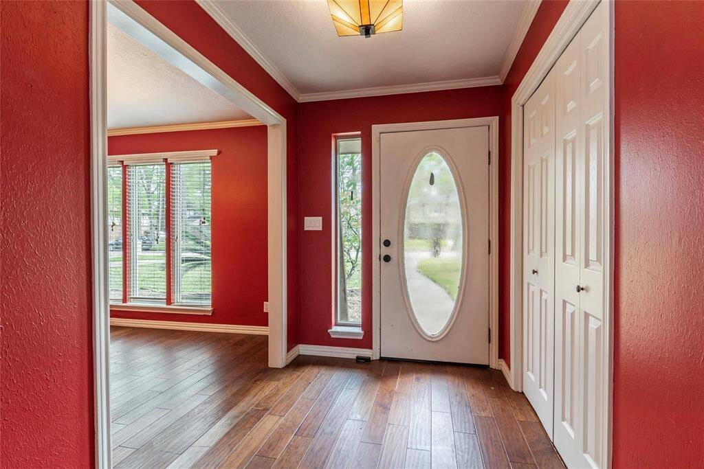 Step into a home that makes a statement—a bold entrance welcomes you with its inviting details and impressive curb appeal.