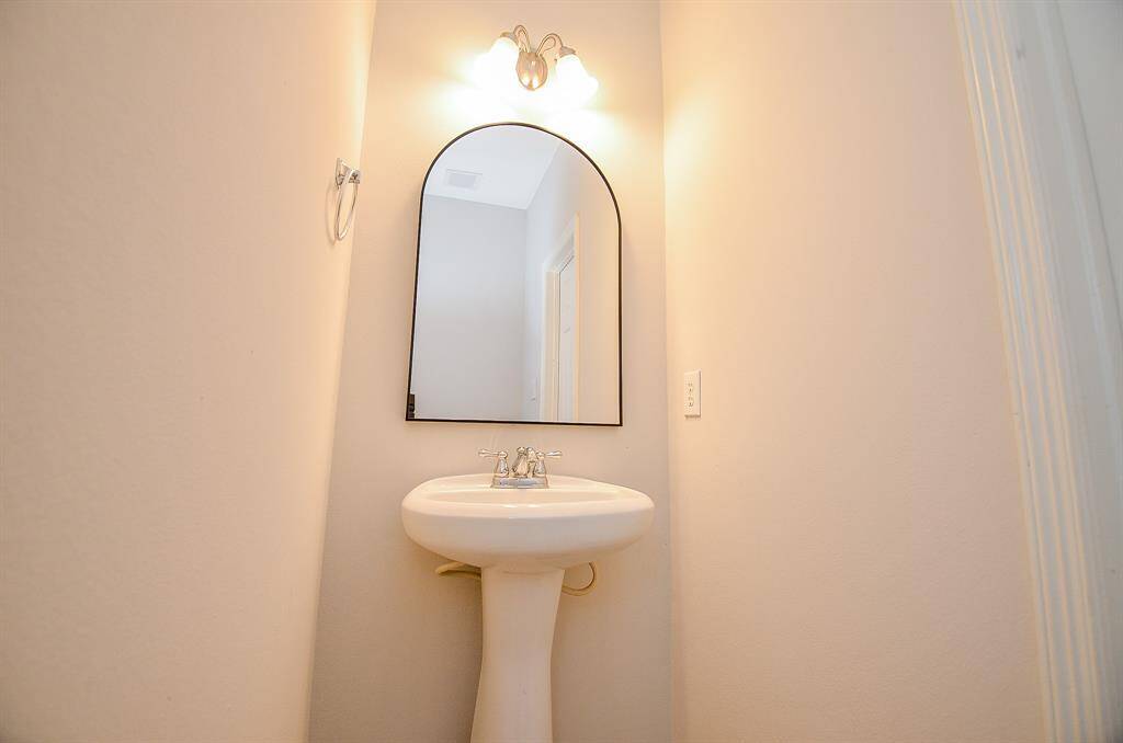 UPDATED POWDER ROOM (NEW LIGHTING FIXTURE, NEW MIRROR AND NEW TOILET )