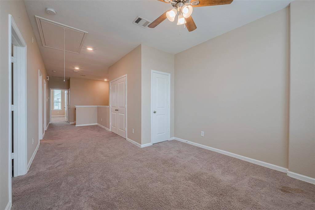 Another view of part of the gameroom and the 2nd floor landing.