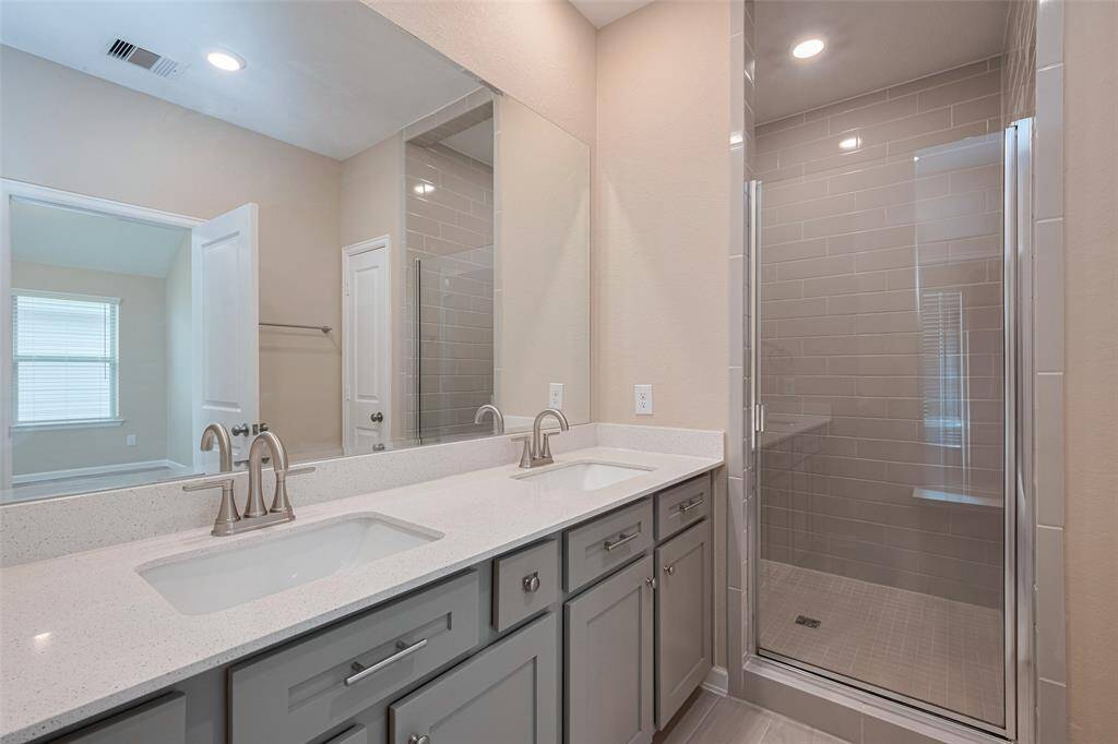 Primary bathroom with double sink vanity