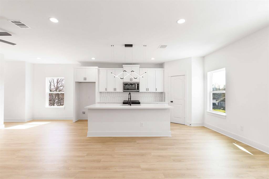The kitchen opens up to the living room creating an inviting environment.