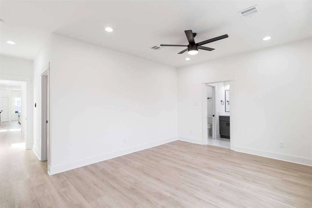 Large primary bedroom can easily accommodate a King bed.