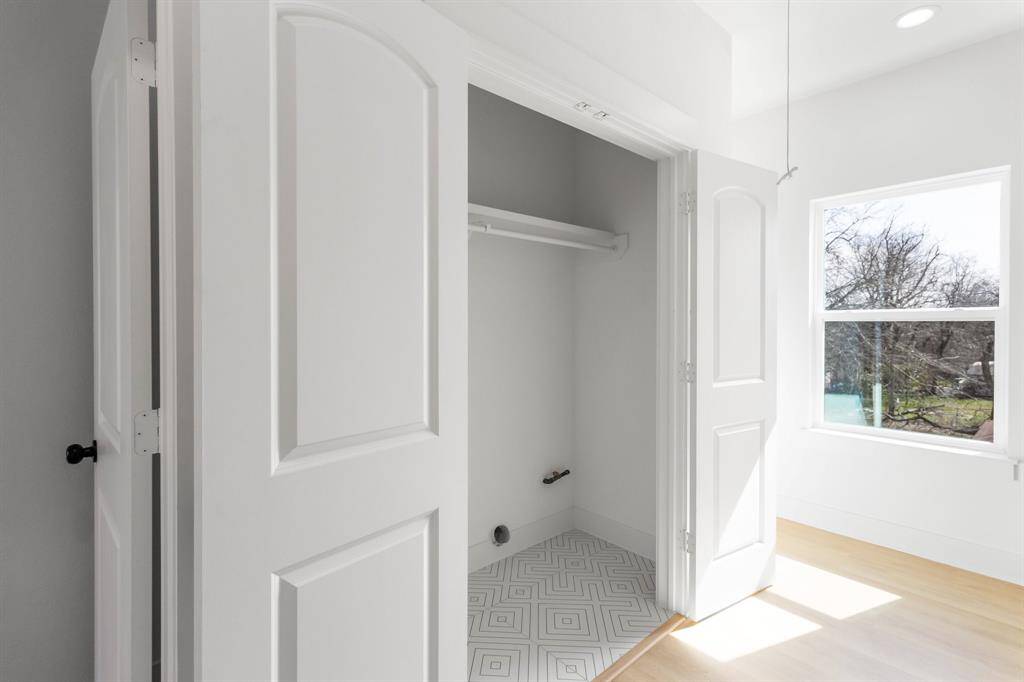 The laundry room is in the hallway. Washer and dryer not pictured but are included.