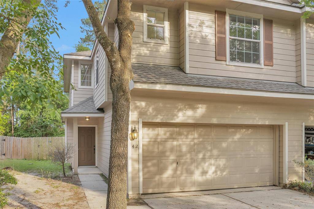 UPDATED throughout! This is a charming two-story townhome centrally located in The Woodlands.