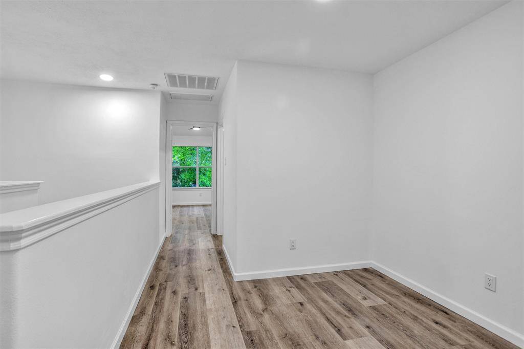 Looking from the upstairs landing towards the two secondary bedrooms