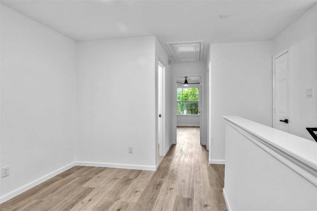 Another view of the landing,  hall to primary bedroom and entrance to laundry