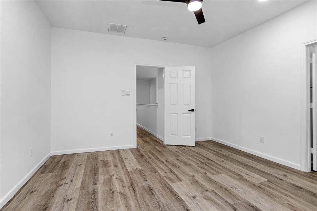 Another view of primary bedroom