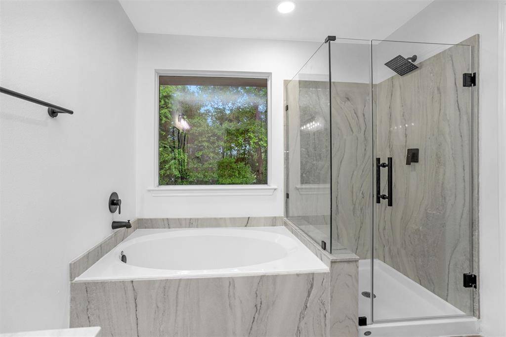 Relax in the large soaking tub and watch the birds.  No back neighbors, just woods.