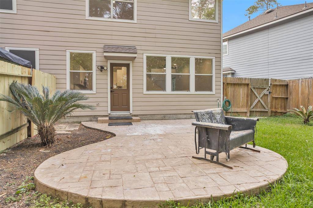Love the backyard.  It is very private with trees behind the brand new fence!