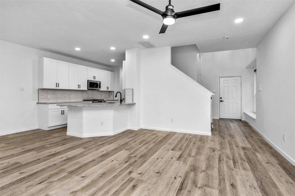 Family room is open to kitchen and breakfast area.