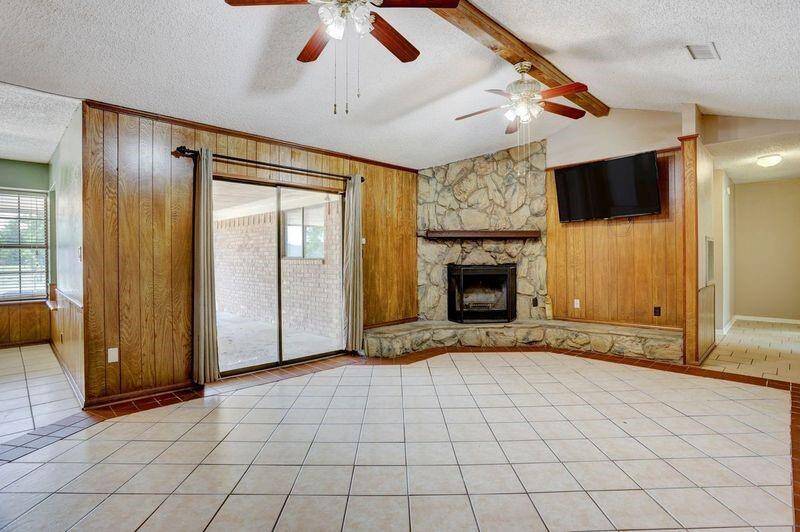 Another Den View with Sliding Glass Door that Opens to Covered Patio and Pool Deck