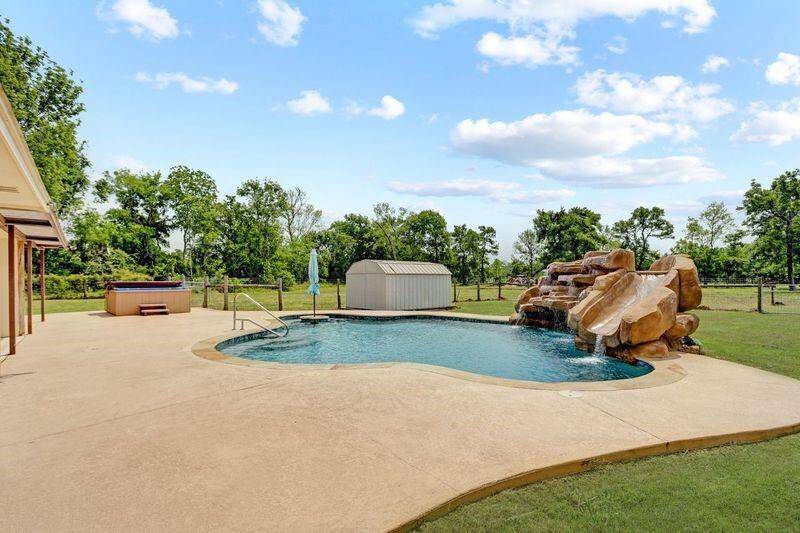 Large Deck Around Pool that has a stand alone Hot Tub on it