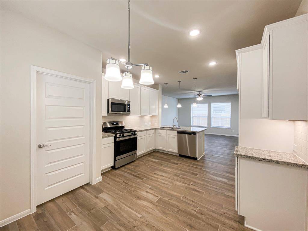 Kitchen has stainless appliances and undermount sink