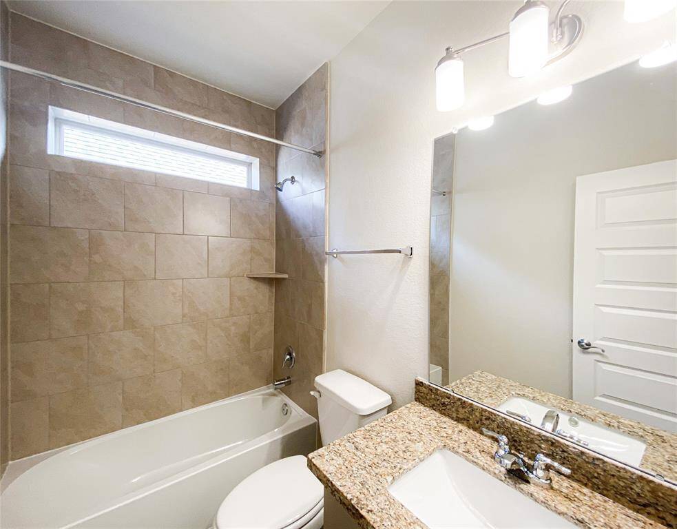 Second full bath downstairs adjacent to the guest bedroom