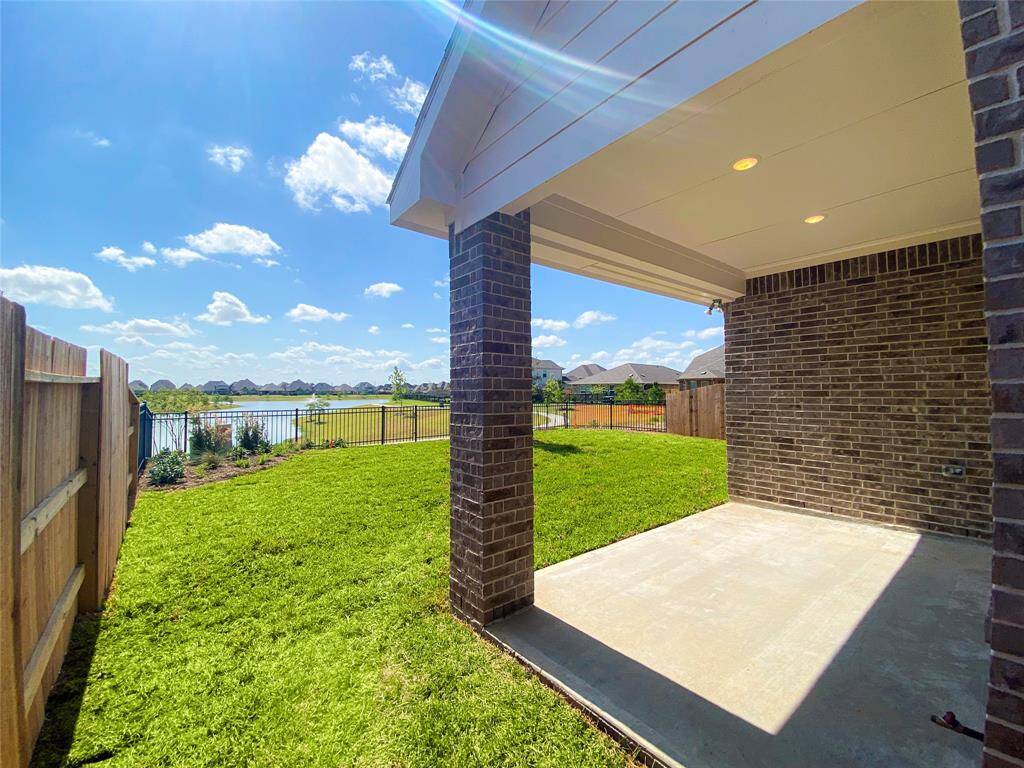 Stunning lake view from this two-story home, enjoy the beauty of nature from your own backyard!