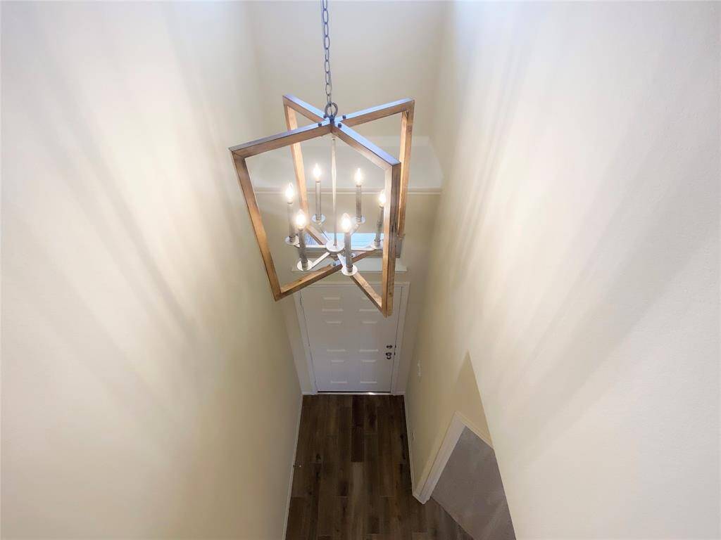 When you enter the home, you are wowed with the tile foyer, soaring ceiling and beautiful chandelier