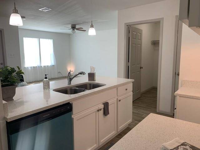 Full-sized laundry room across from kitchen
